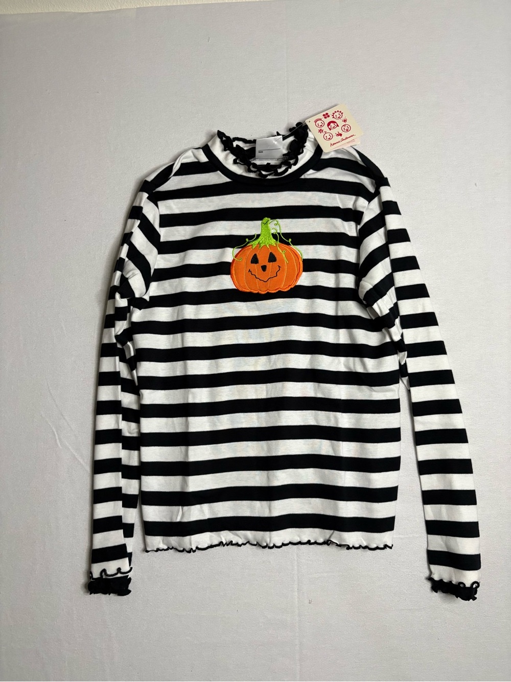 Hanna Andersson Black and White Striped Long-Sleeve Top with Orange Pumpkin